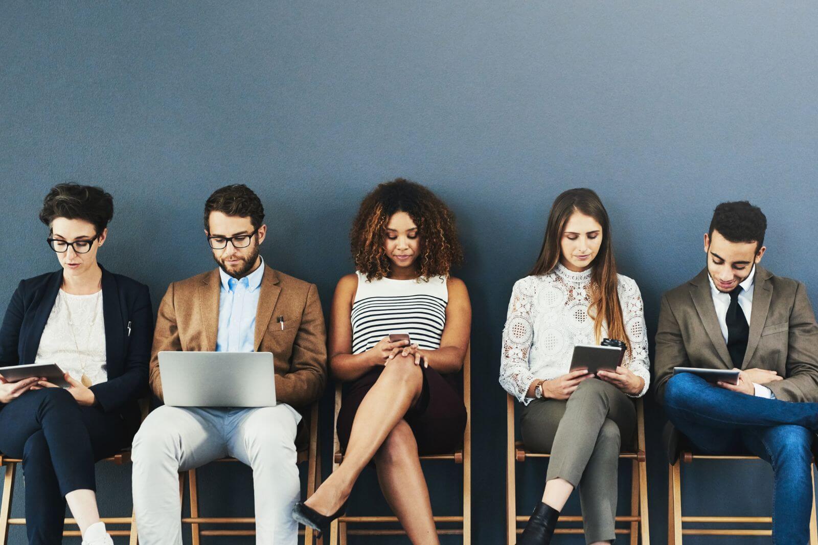 a group of people waiting for a job interview