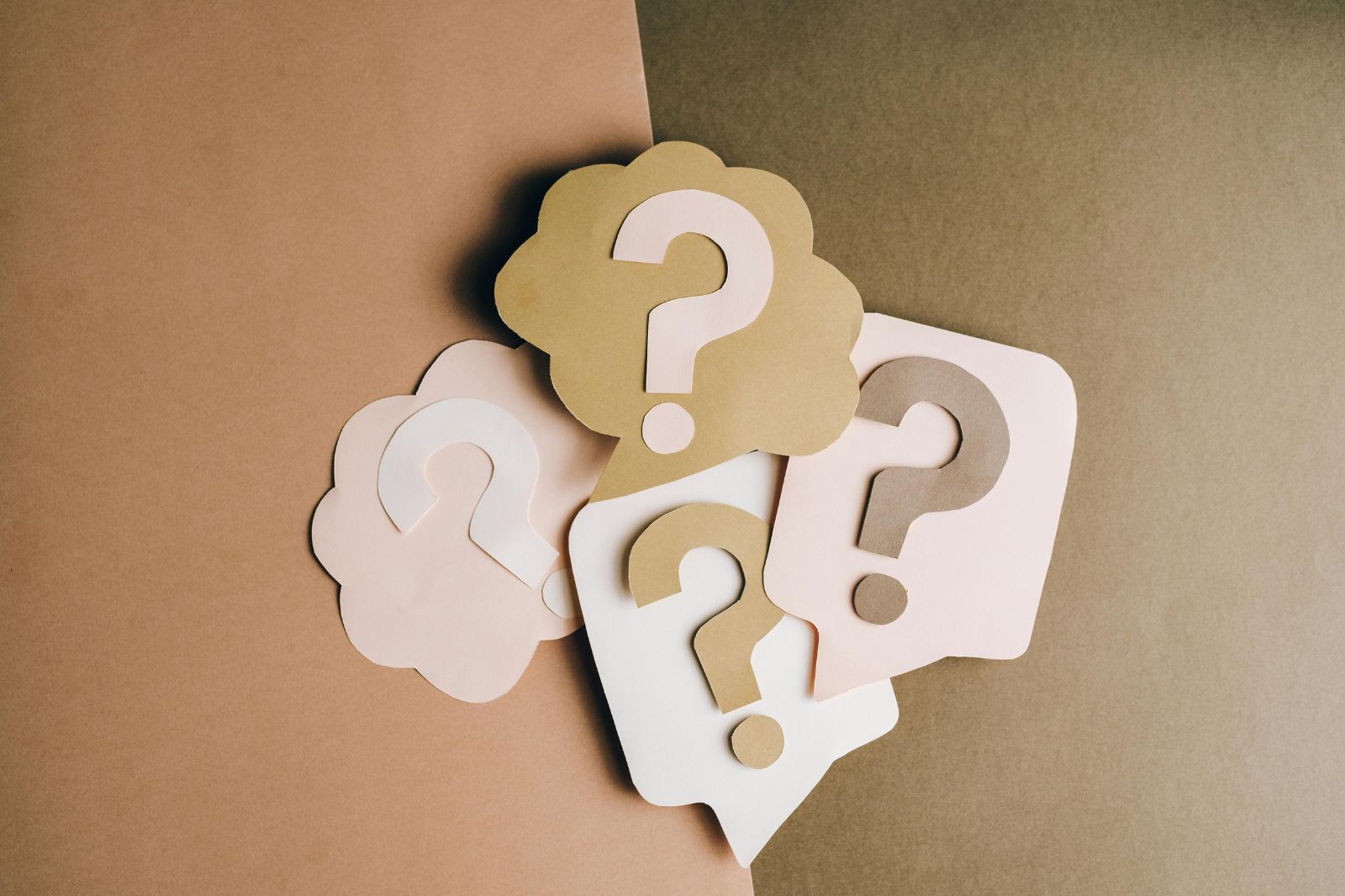 a group of paper question marks