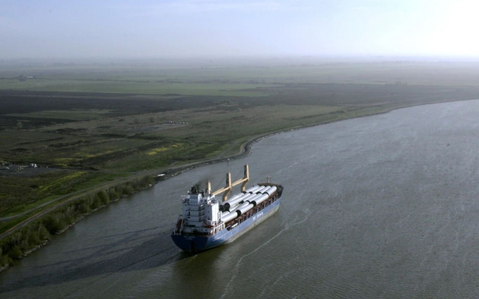 A ship sails through the Sacramento-San Joaquin River Delta