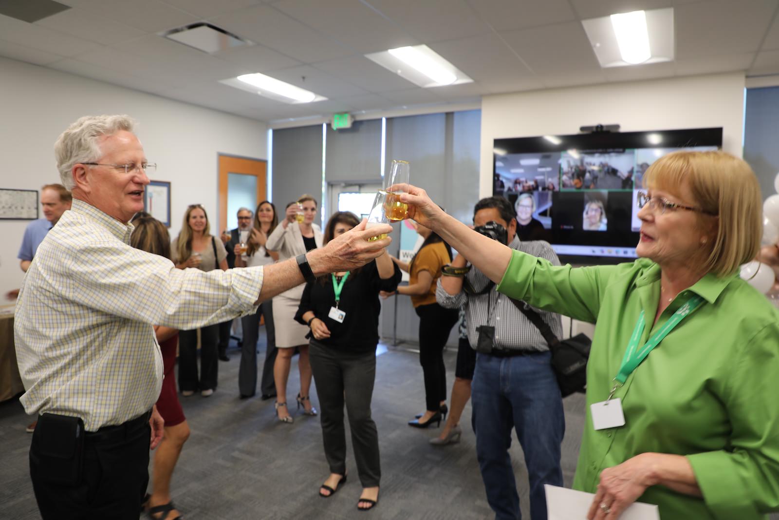 Kay Ruhstaller toasting to winning the Athena award