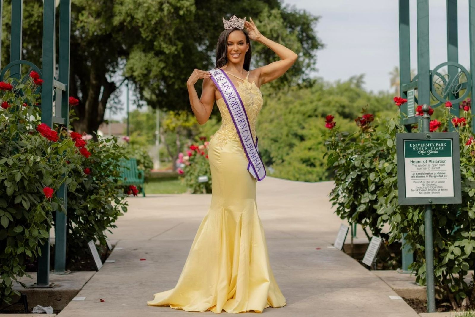 Lakeisha Little-Shaw wearing crown and Northern California sash in garden walkway