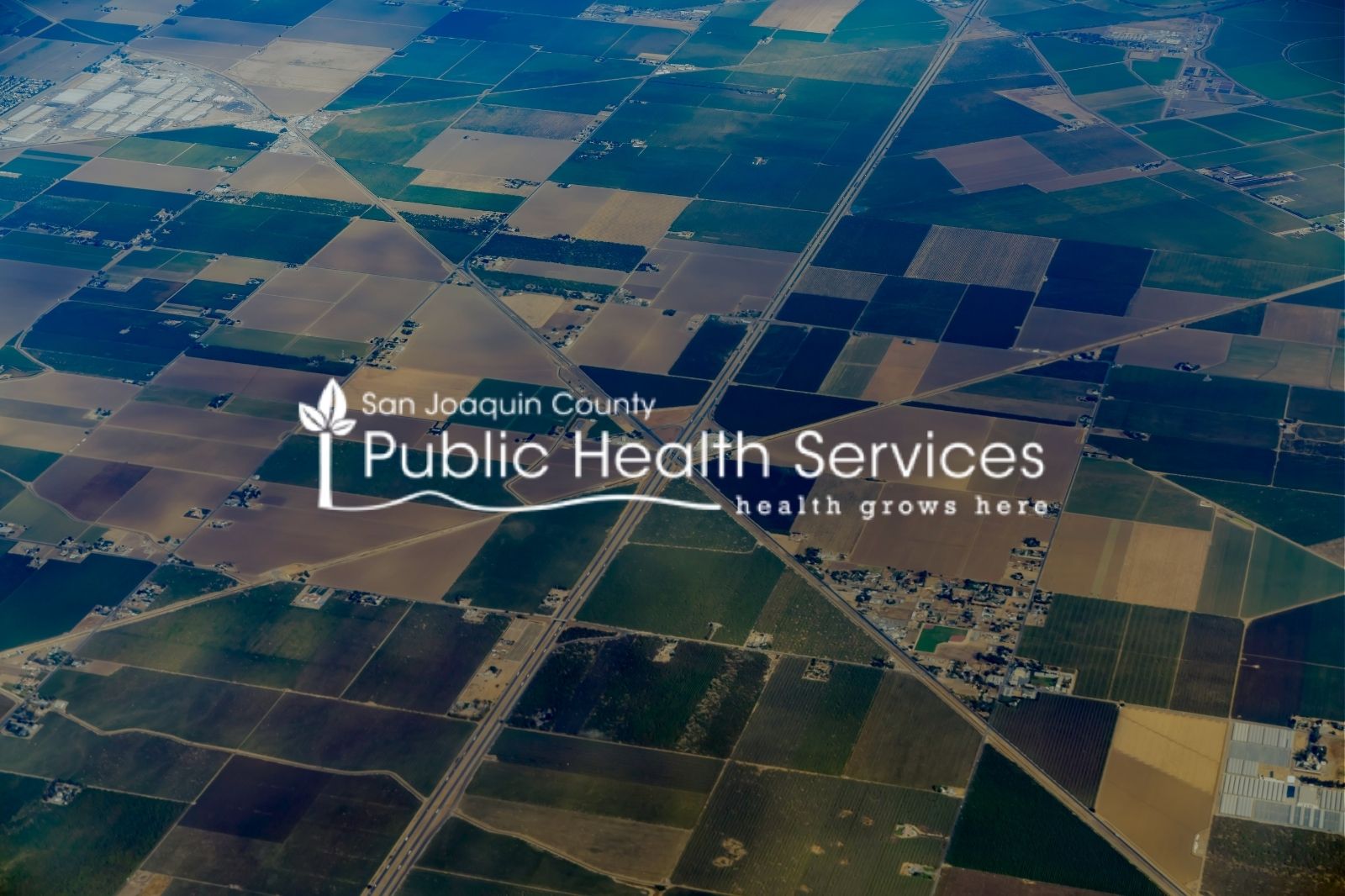 Aerial view of San Joaquin County with the SJC Public Health Services logo on top. 